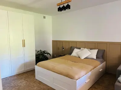 Łóżko lub łóżka w pokoju w obiekcie Dom z ogrodem w zaciszu W-wy