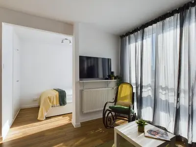 Telewizja i/lub zestaw kina domowego w obiekcie Warsaw City Centre - Apartment for 3 people by Noclegi Renters