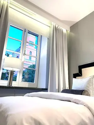 Łóżko lub łóżka w pokoju w obiekcie MONDRIAN Luxury Suites & Apartments Market Square IV