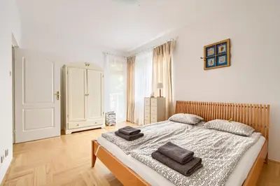 Łóżko lub łóżka w pokoju w obiekcie Orla Residence