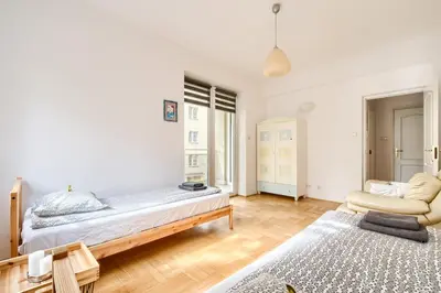 Łóżko lub łóżka w pokoju w obiekcie Orla Residence