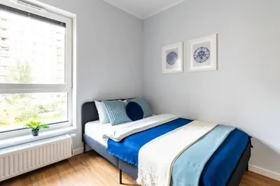 Łóżko lub łóżka w pokoju w obiekcie Aleja Krakowska SuperApart Modern Studio