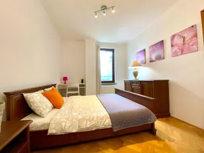 Łóżko lub łóżka w pokoju w obiekcie Center Warsaw - Apartmenty Jana Pawła II