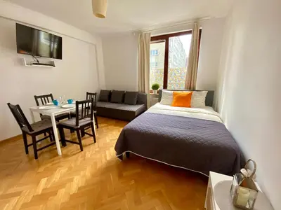 Łóżko lub łóżka w pokoju w obiekcie Center Warsaw - Apartmenty Jana Pawła II