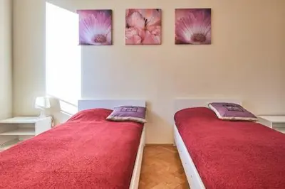 Łóżko lub łóżka w pokoju w obiekcie Center Warsaw - Apartmenty Jana Pawła II