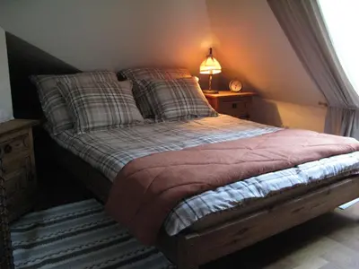 Łóżko lub łóżka w pokoju w obiekcie Cozy and Comfortable Guest House in the City