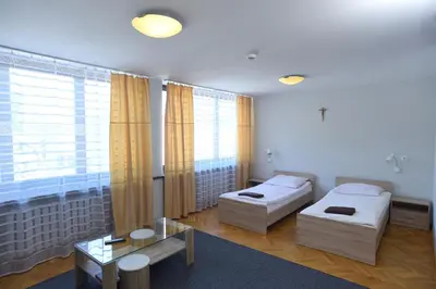 Łóżko lub łóżka w pokoju w obiekcie Dobre Miejsce Dom Rekolekcyjny