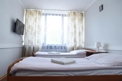Łóżko lub łóżka w pokoju w obiekcie Dobre Miejsce Dom Rekolekcyjny