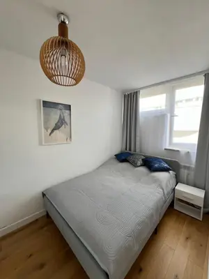 Łóżko lub łóżka w pokoju w obiekcie ApartamentW3M
