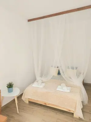 Łóżko lub łóżka w pokoju w obiekcie Rental Apartments Smoluchowskiego