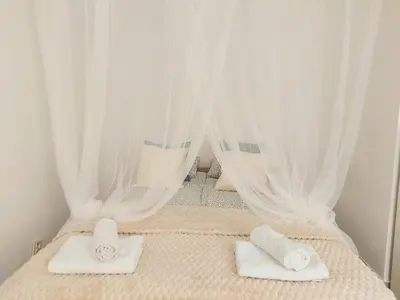 Łóżko lub łóżka w pokoju w obiekcie Rental Apartments Smoluchowskiego