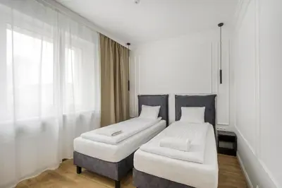 Łóżko lub łóżka w pokoju w obiekcie Labo Apartment Marszałkowska