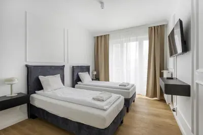 Łóżko lub łóżka w pokoju w obiekcie Labo Apartment Marszałkowska