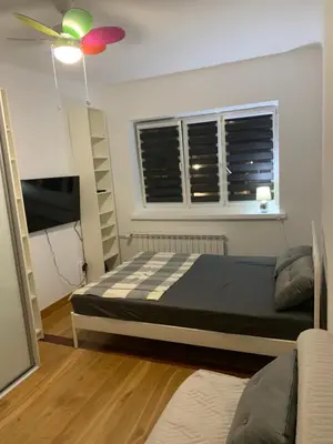 Łóżko lub łóżka w pokoju w obiekcie Apartament na zielonym Nowolipiu