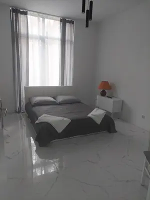 Łóżko lub łóżka w pokoju w obiekcie Apartamenty Nogalin