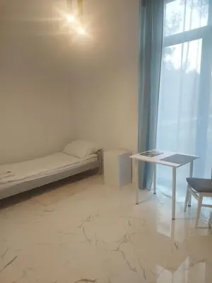 Łóżko lub łóżka w pokoju w obiekcie Apartamenty Nogalin