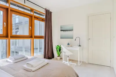 Łóżko lub łóżka w pokoju w obiekcie P&O Apartments Arkadia 1