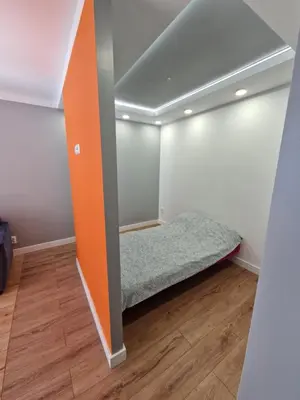 Łóżko lub łóżka w pokoju w obiekcie Centrum Apartament