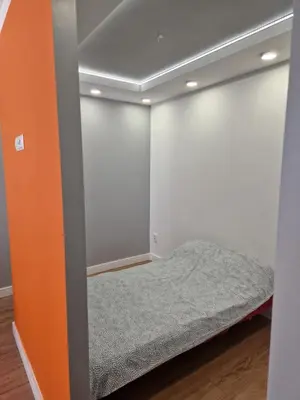 Łóżko lub łóżka w pokoju w obiekcie Centrum Apartament