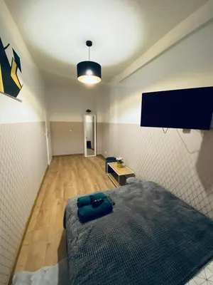Łóżko lub łóżka w pokoju w obiekcie ClickTheFlat Wola Apart Rooms