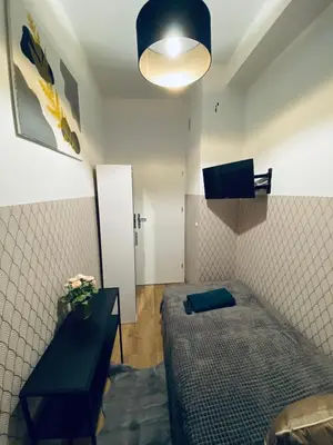 Telewizja i/lub zestaw kina domowego w obiekcie ClickTheFlat Wola Apart Rooms
