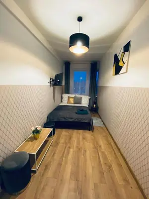 Łóżko lub łóżka w pokoju w obiekcie ClickTheFlat Wola Apart Rooms