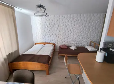 Łóżko lub łóżka w pokoju w obiekcie Złota Center Apartament