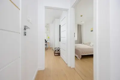 Łóżko lub łóżka w pokoju w obiekcie Family Apartment with Balcony by Noclegi Renters