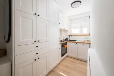 Kuchnia lub aneks kuchenny w obiekcie Aleja Waszyngtona Deluxe Apartment by BookingHost