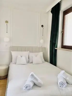 Łóżko lub łóżka w pokoju w obiekcie Elegancki apartament z jedną sypialnią