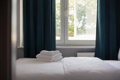 Łóżko lub łóżka w pokoju w obiekcie Praga Kinowa Comfy Apartment by BookingHost