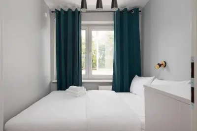 Łóżko lub łóżka w pokoju w obiekcie Praga Kinowa Comfy Apartment by BookingHost