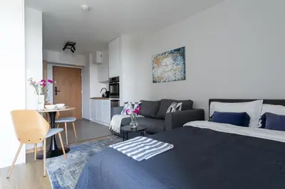 Łóżko lub łóżka w pokoju w obiekcie Blue Apartment Warszawa Praga