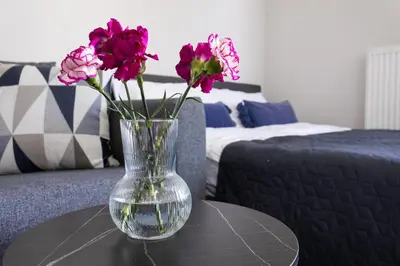 Łóżko lub łóżka w pokoju w obiekcie Blue Apartment Warszawa Praga