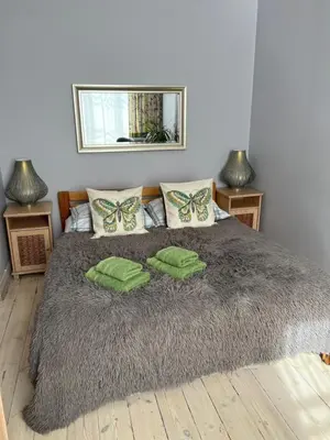 Łóżko lub łóżka w pokoju w obiekcie Apartament 105 Centrum