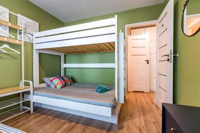 Łóżko lub łóżka w pokoju w obiekcie Apart Rooms City Centr