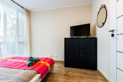 Łóżko lub łóżka w pokoju w obiekcie Apart Rooms City Centr