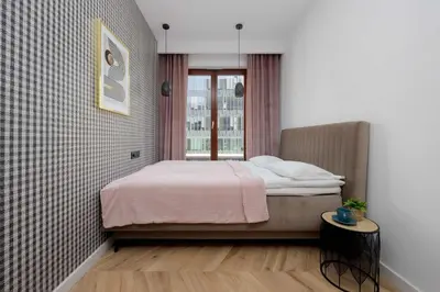 Łóżko lub łóżka w pokoju w obiekcie Tasteful Apartment with Parking by Noclegi Renters