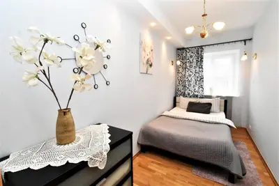 Łóżko lub łóżka w pokoju w obiekcie Rental Apartments Piwna