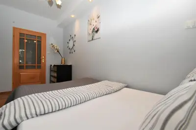 Łóżko lub łóżka w pokoju w obiekcie Rental Apartments Piwna