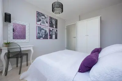 Łóżko lub łóżka w pokoju w obiekcie Stylish Apartment in Downtown Warsaw by Noclegi Renters