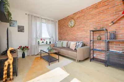 Część wypoczynkowa w obiekcie Exceptional Apartment in Warsaw with Parking by Noclegi Renters
