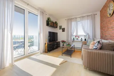 Telewizja i/lub zestaw kina domowego w obiekcie Exceptional Apartment in Warsaw with Parking by Noclegi Renters