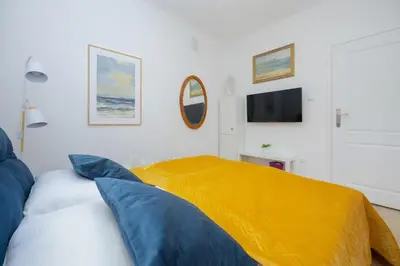 Łóżko lub łóżka w pokoju w obiekcie Exceptional Apartment for 4 People by Noclegi Renters