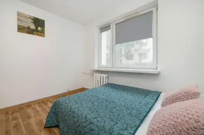Łóżko lub łóżka w pokoju w obiekcie Merliniego Trendy Apartment with Desk by Noclegi Renters