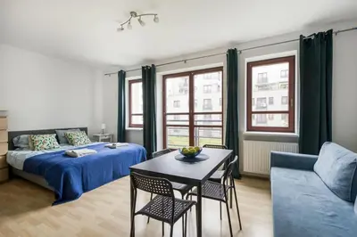 Łóżko lub łóżka w pokoju w obiekcie Apartament Stadion