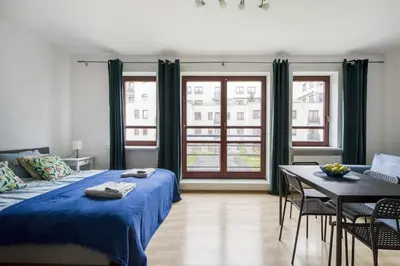 Łóżko lub łóżka w pokoju w obiekcie Apartament Stadion