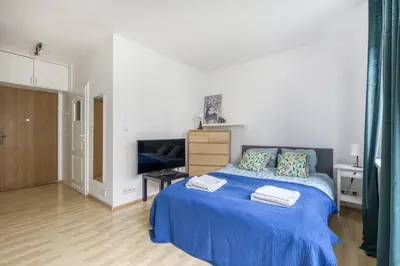 Łóżko lub łóżka w pokoju w obiekcie Apartament Stadion