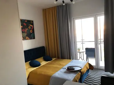 Łóżko lub łóżka w pokoju w obiekcie Apartment