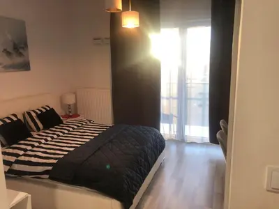 Łóżko lub łóżka w pokoju w obiekcie Apartment